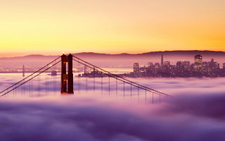 Foggy bridge sunset city distance - a bridge in the middle free wallpaper