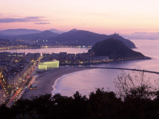 City night beach mountains water - the background and a body of water free wallpaper