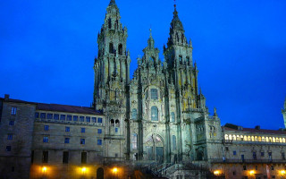 Cathedral clock tower night city - the front of it free wallpaper
