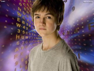Boy standing wall letters clock - a boy free wallpaper