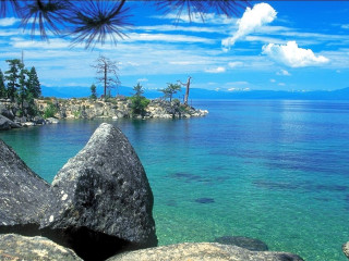 Lake rock outcropping blue sky - cloud above free wallpaper