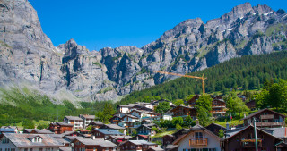 Town crane mountains distance crane - a mountain side free wallpaper