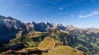 Mountain range grassy slope trees 2 - a few mountain free wallpaper