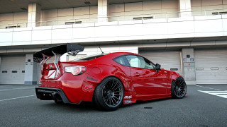 Red sports car parking lot 54 - clean free wallpaper