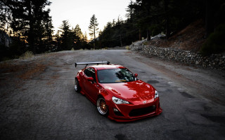 Red sports car forest stone - clean free wallpaper