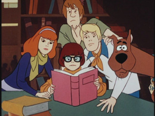 People table dog reading book - a group of people sitting free wallpaper