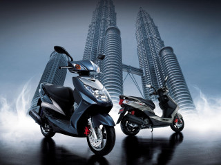Motorcycles parked tall building spire - a spire free wallpaper