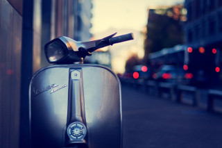Scooter parked street building streetlight - a street light in the background free wallpaper