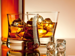 Whiskey glass ice cubes bottle - a reflection free wallpaper