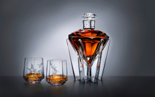 Whiskey bottle two glasses table - a gray background free wallpaper