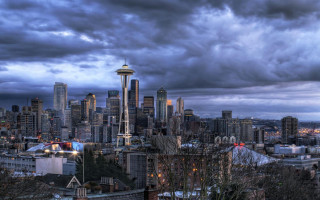 City skyline dark sky clouds - everett warner free wallpaper
