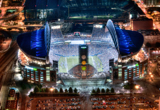 Stadium large clock tower nighttime - a large clock tower free wallpaper