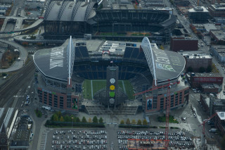 Stadium cars parked clock tower - tilt shift free wallpaper