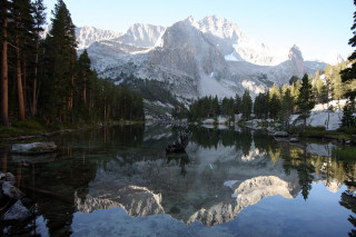 Mountain lake boat forest castle - a still lake free wallpaper