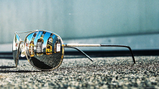 Sunglasses reflection building lens image - a pair of sunglasses free wallpaper