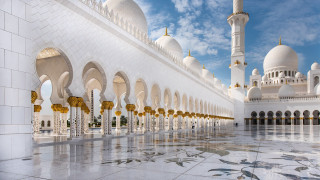 Large white building arches sky - a large white building free wallpaper
