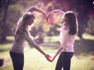 Girls holding hands park trees - free love wallpaper