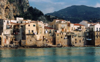 Buildings cliff ocean mountain background - color film photography free wallpaper