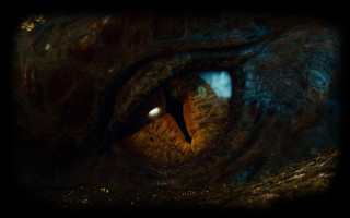 Dragon eye closeup dark background - weta digital free wallpaper