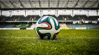 Soccer ball green field stadium 4 - a lush green field next free wallpaper