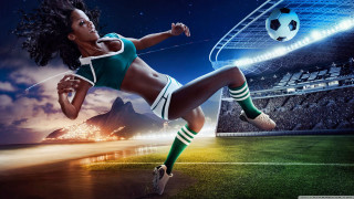 Woman kicking soccer ball grass - a stadium free wallpaper