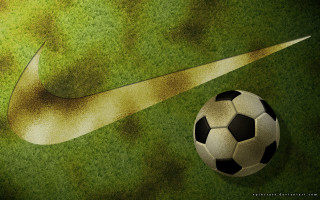 Soccer ball nike logo green - a green field of grass free wallpaper