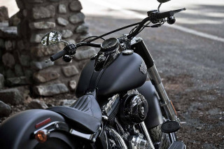 Motorcycle parked stone wall tree - a light free wallpaper