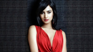 Woman red dress hands hips - promotional image free wallpaper