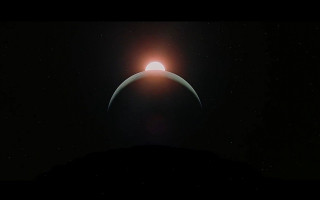 Bright sun earth dark sky - over the earth free wallpaper