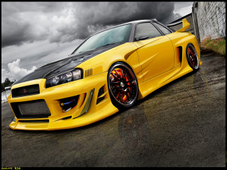 Yellow car parked street cloudy - a black car in the foreground free wallpaper