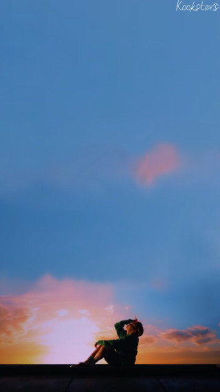Person sitting ledged sky sunset - a ledge free wallpaper