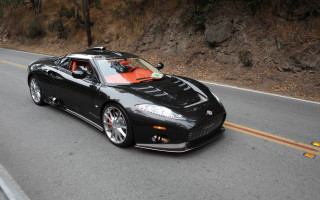 Black sports car cliff road - a road next free wallpaper