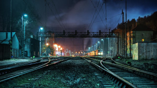 Train track night crossing street - a train free wallpaper