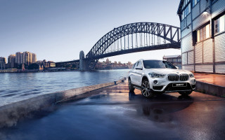 White bmw suv parked bridge - a bridge and a river free wallpaper