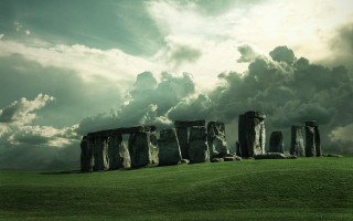 Stonehenges cloudy sky green field - mystical free wallpaper