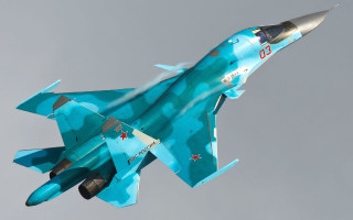 Blue fighter jet gray sky - a gray sky free wallpaper