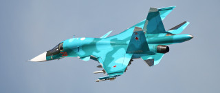 Blue fighter jet flying blue - the side of its free wallpaper