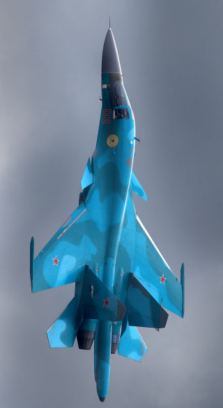 Blue fighter jet cloudy sky - a cloudy sky free wallpaper