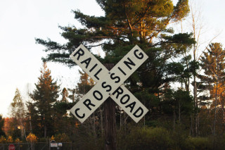 Railroad crossing sign road forest - the side of a road next free wallpaper