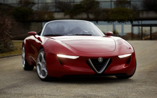 Red sports car driving road - a building and trees free wallpaper
