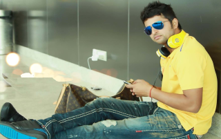 Man sitting headphones yellow shirt - movie still frame free wallpaper