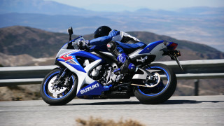 Motorcycle ride mountains hills background - leaning free wallpaper