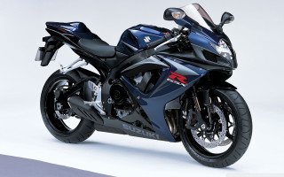 Blue motorcycle parked white surface - a blue motorcycle free wallpaper
