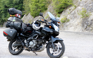 Motorcycle helmet parked road cliff - viennese actionism free wallpaper