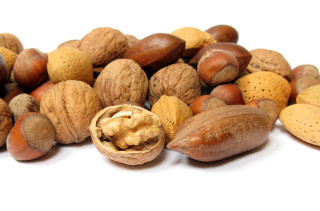 Pile of nuts with one - product photo free wallpaper