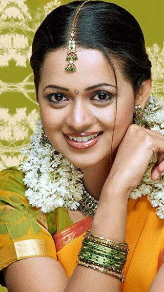 Woman yellow sari flower hair - movie still frame free wallpaper