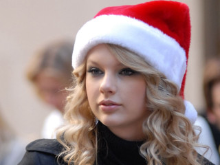 Woman santa hat serious look - her face and shoulder free wallpaper