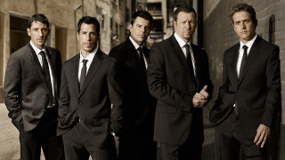 Men suits group standing building - a group of men free wallpaper