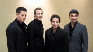 Men group standing room wall - a wall behind them free wallpaper