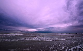 Purple sky boat ocean waves - a boat in the distance free wallpaper